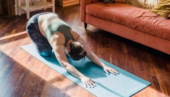 Person making small lifestyle changes at home to build healthier habits