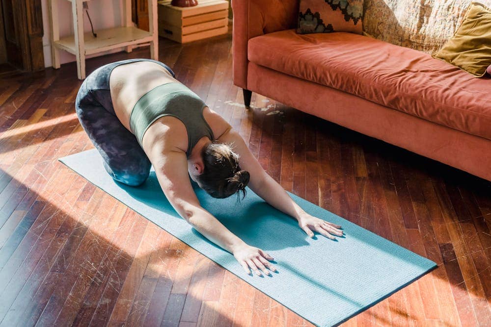 Person making small lifestyle changes at home to build healthier habits